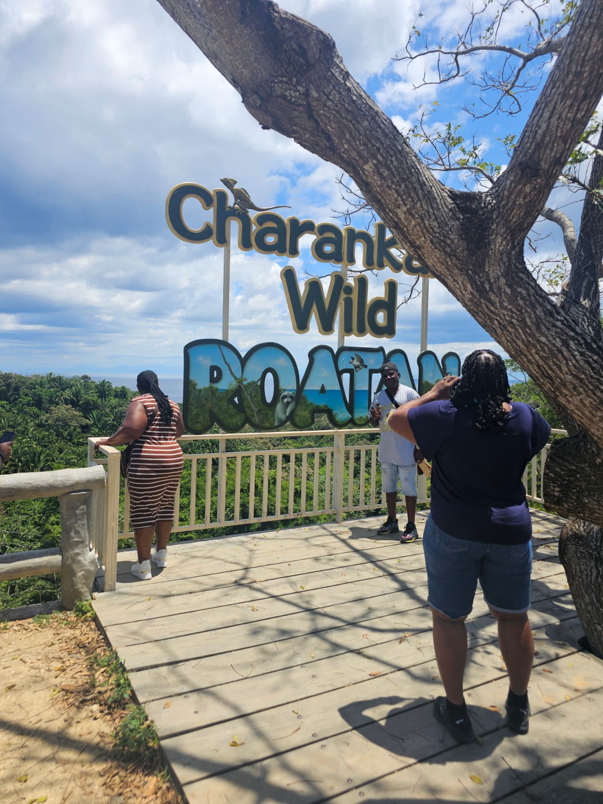 Visitors taking photos at the Charankako Wild Roatán lookout